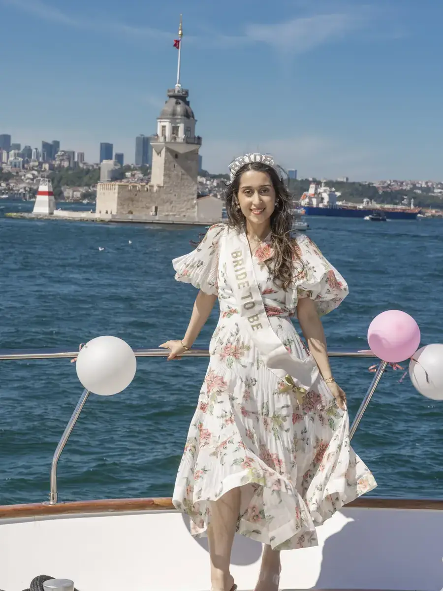 Bride to be on a yacht with the Maiden's Tower
