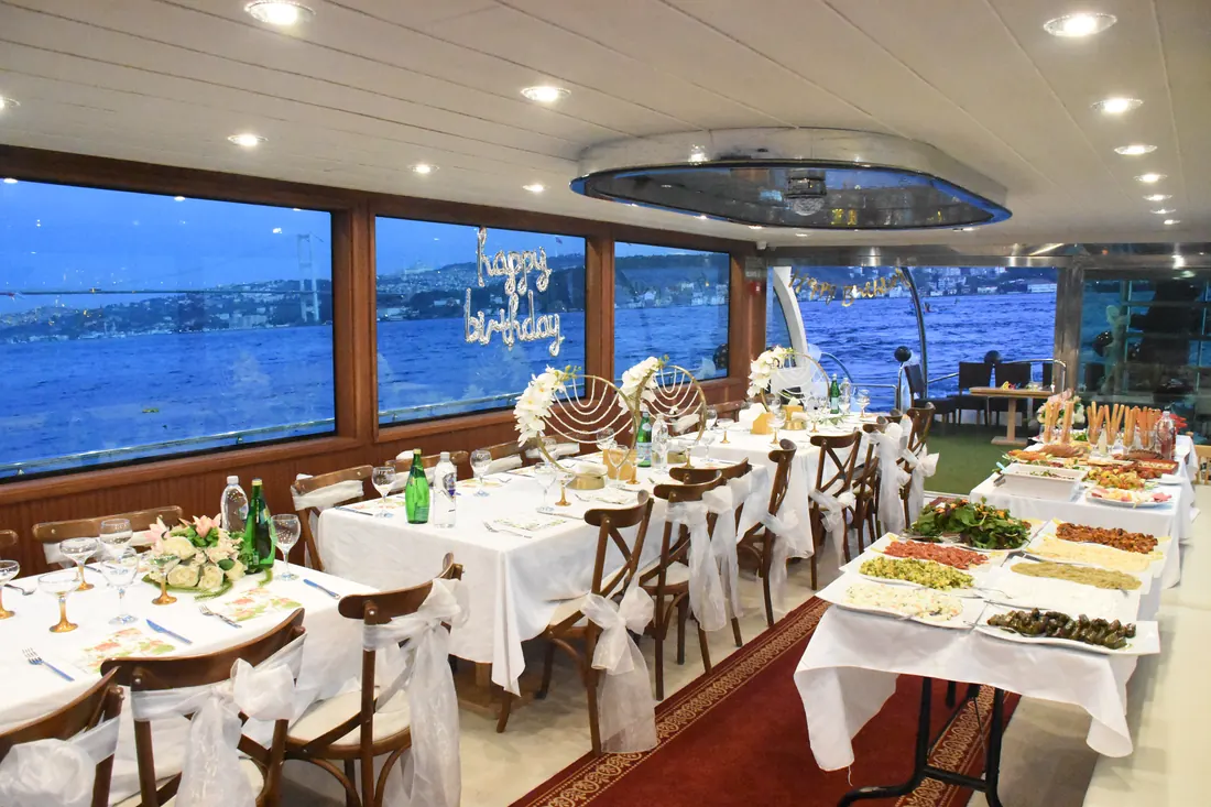 Yacht saloon decorated for a birthday dinner