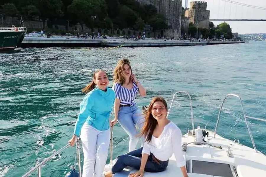 Friends on the bow of the boat on the way to the Black Sea