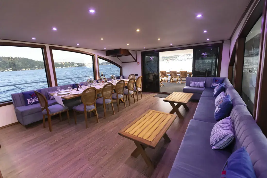 Yacht saloon with a long table for breakfast