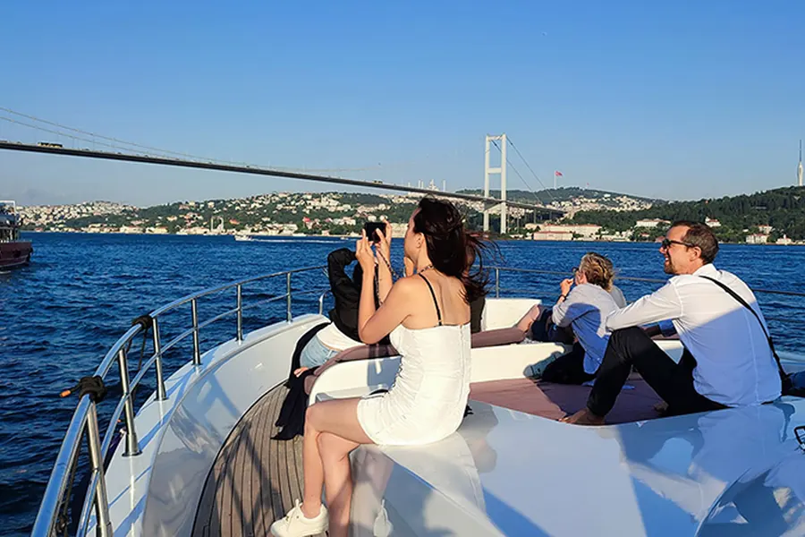 Guests taking photos of the sun going down over Istanbul from the yacht