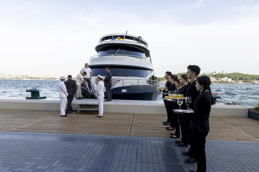 Crew welcoming guests to an event yacht