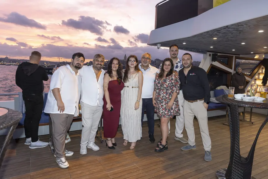 Team photo on a yacht at sunset