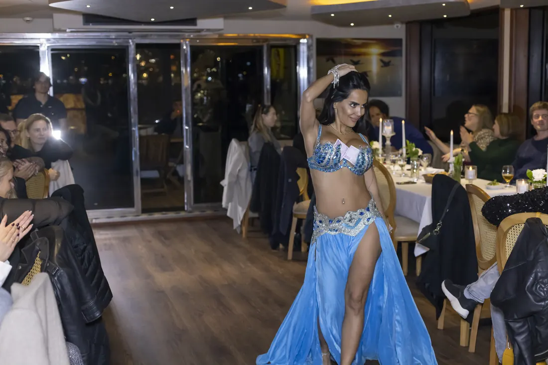 Belly dancer performing at a company party on a yacht