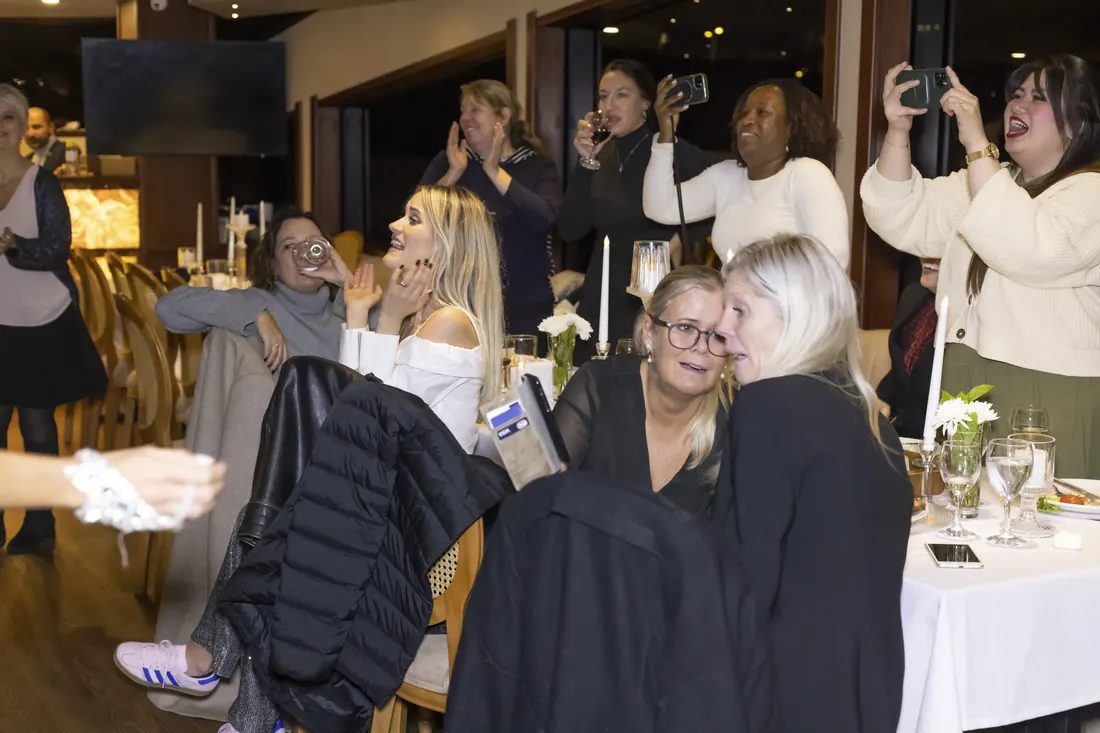 Guests celebrating in the saloon of a party yacht