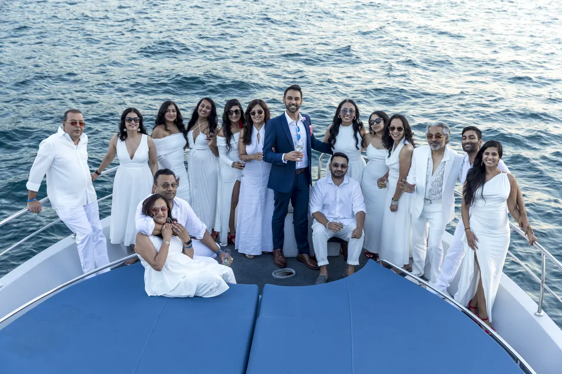 Company white party on the bow of a yacht