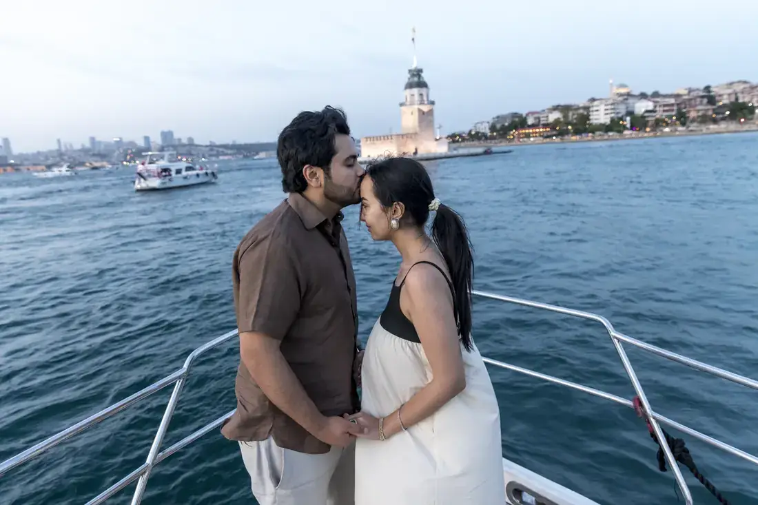 Couple on the bow of a yacht by the Maiden's Tower
