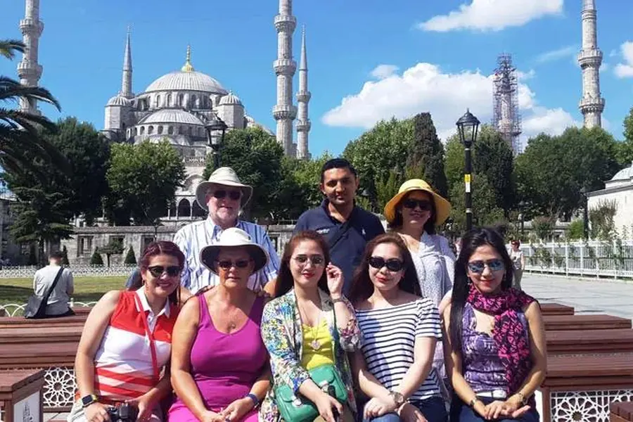 Guests with their guide in front of the Blue Mosque