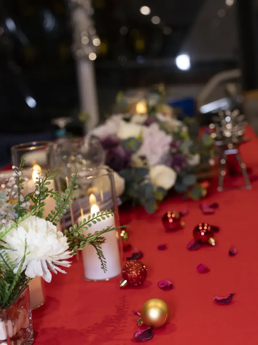 Red table decoration with flowers for a proposal