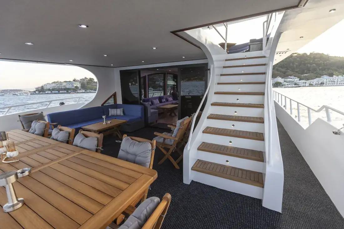Aft deck and stairs to the upper deck of a yacht