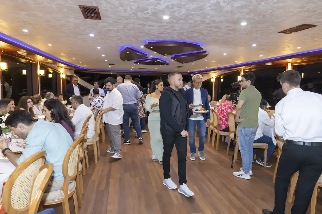 Team gathering in the saloon of a yacht