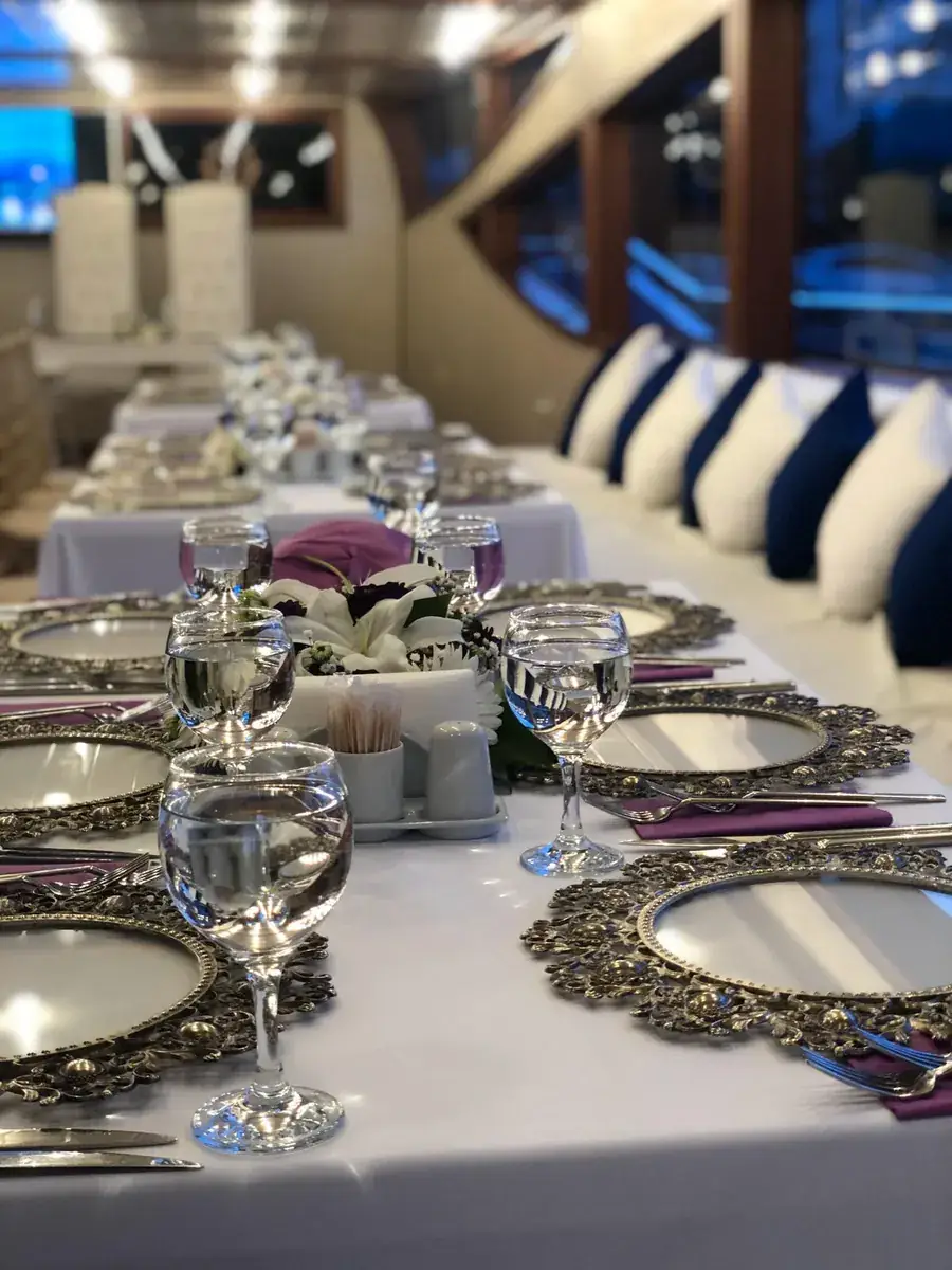 Place settings for a wedding reception on a yacht