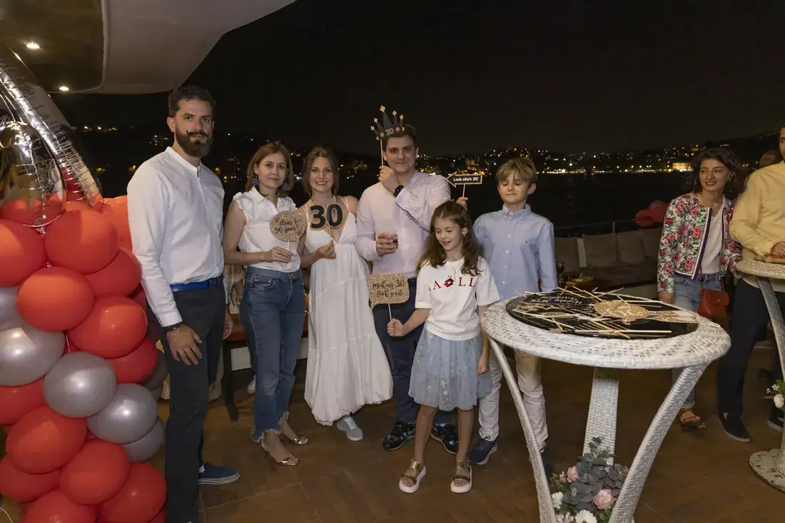 Birthday party with balloons on a yacht deck