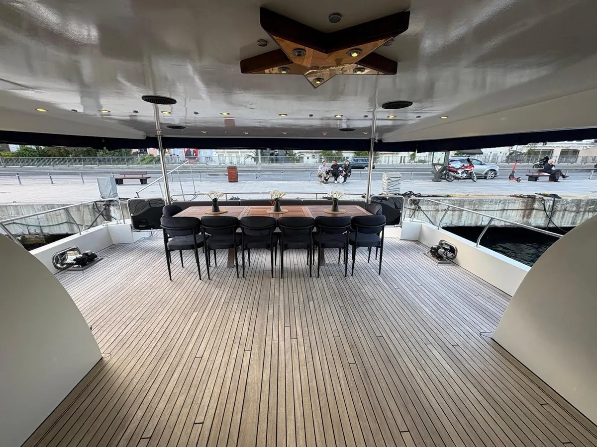 Long dinner table on the aft deck of Blue Wave