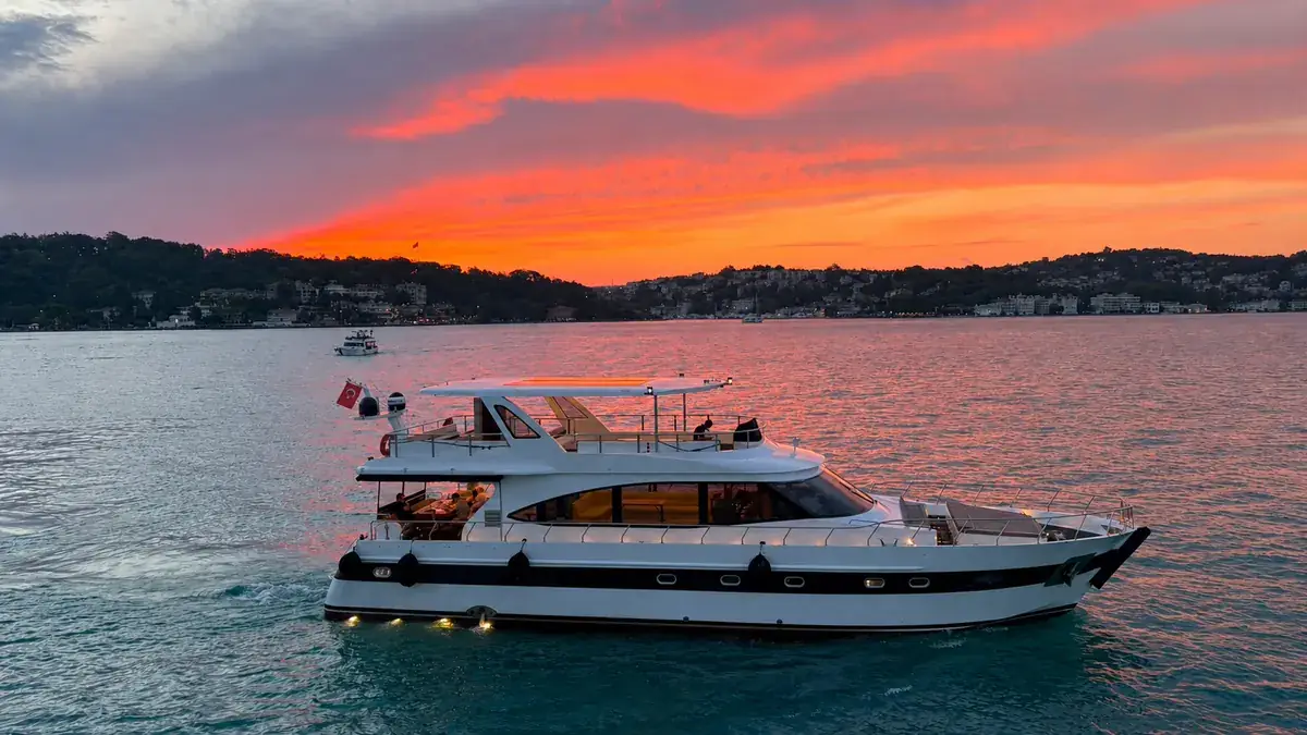 Sea Fairy yacht under a red sunset sky