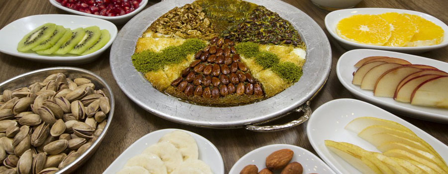 Hot kunefe with melted cheese and crushed pistachios