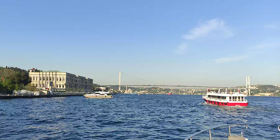 Boat cruising the Bosphorus strait with the Istanbul skyline behind