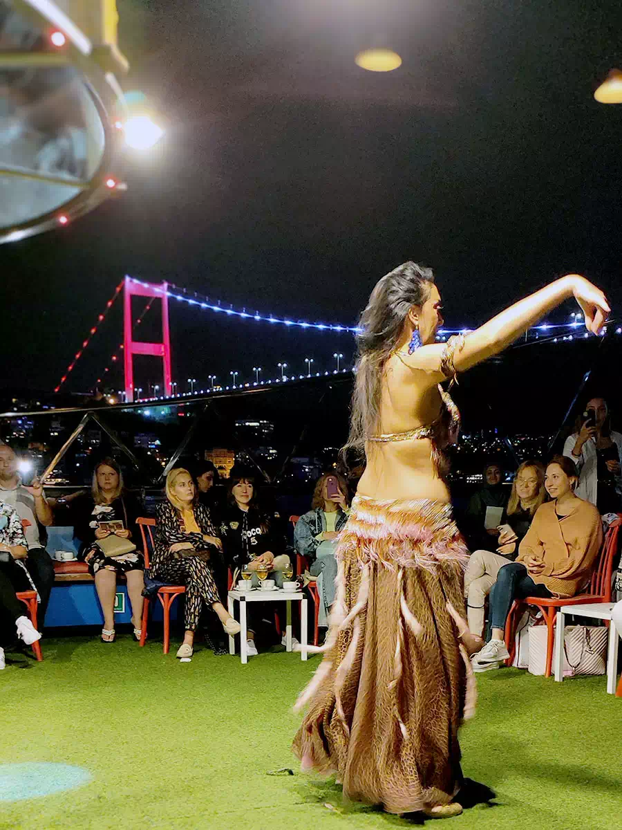 Guests at dinner tables on a Bosphorus dinner cruise boat in Istanbul