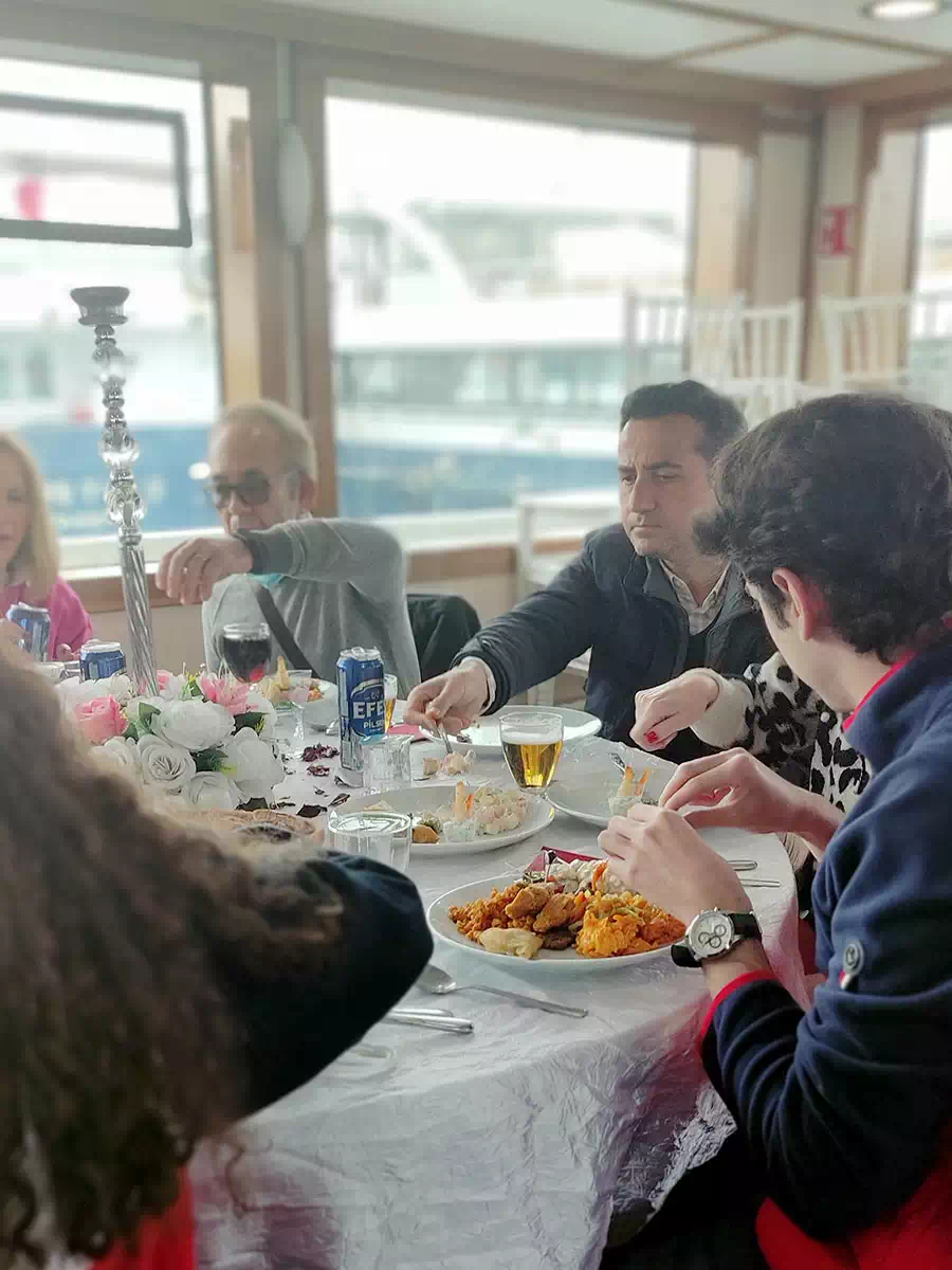 Guests dining on a private yacht cruising the Bosphorus
