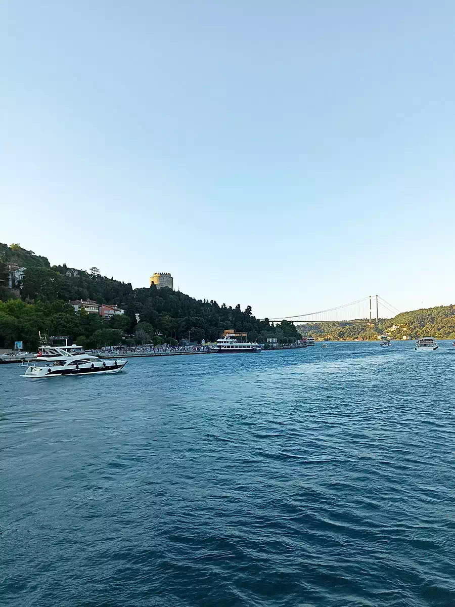 Private yacht cruising the Bosphorus in Istanbul with guests on deck