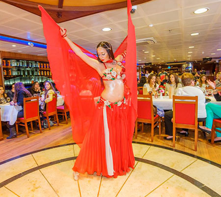 Belly dancer performing for guests on a Bosphorus dinner cruise