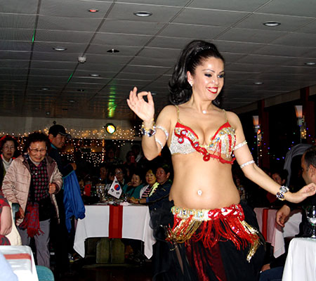 Turkish night show performers on stage during a Bosphorus dinner cruise