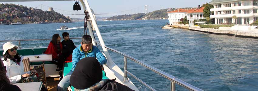 Bosphorus cruise boat sailing between Europe and Asia