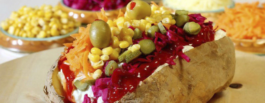 Kumpir, stuffed baked potato with toppings in Ortaköy