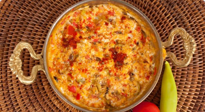 Menemen, Turkish scrambled eggs with tomato and peppers, served in a pan